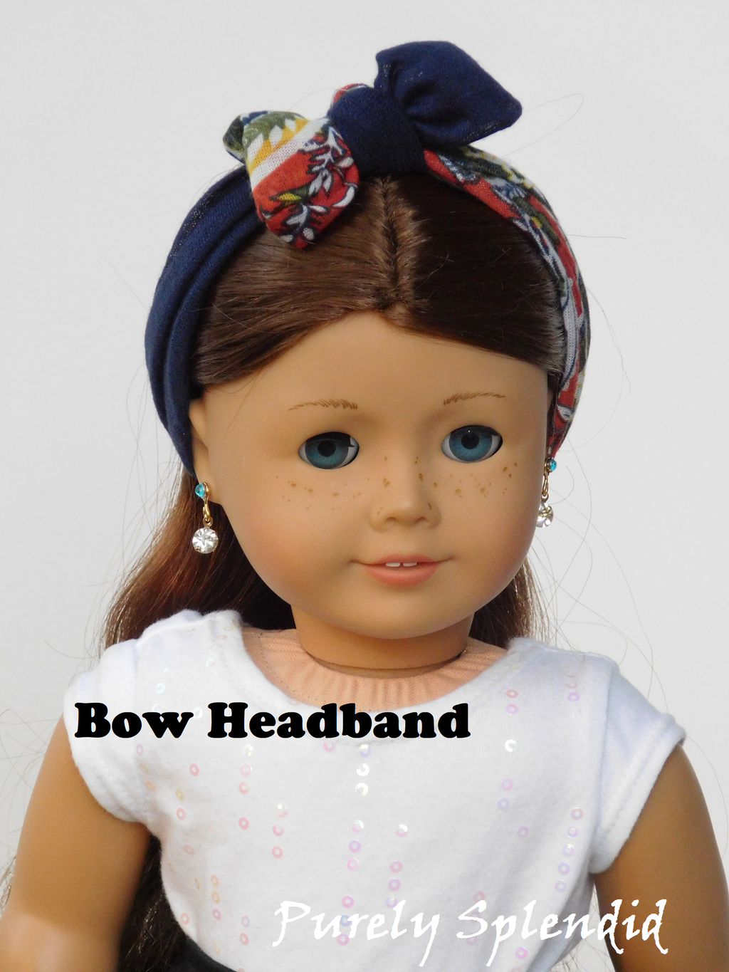 Orange Floral and Navy Infinite Scarves worn as a Bow Headband on an 18 inch doll