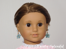 Load image into Gallery viewer, 18 inch doll shown wearing a pair of Pastel Flower Earring Dangles and coordinating Stud Earrings

