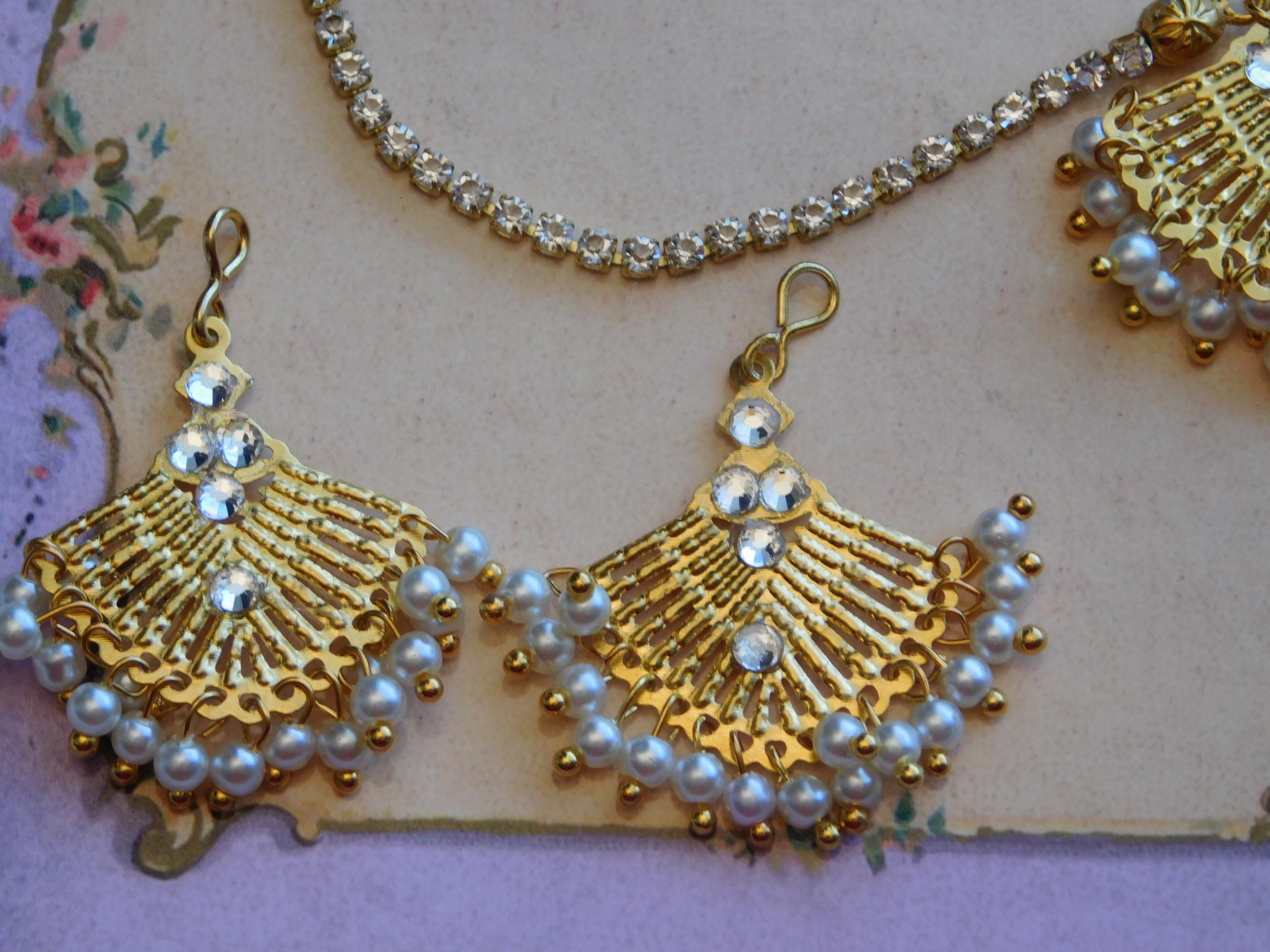 Beautiful Pearl Bollywood Earrings that match the Maang Tikka - gold colored fan shapes with lots of tiny pearls hanging from them.