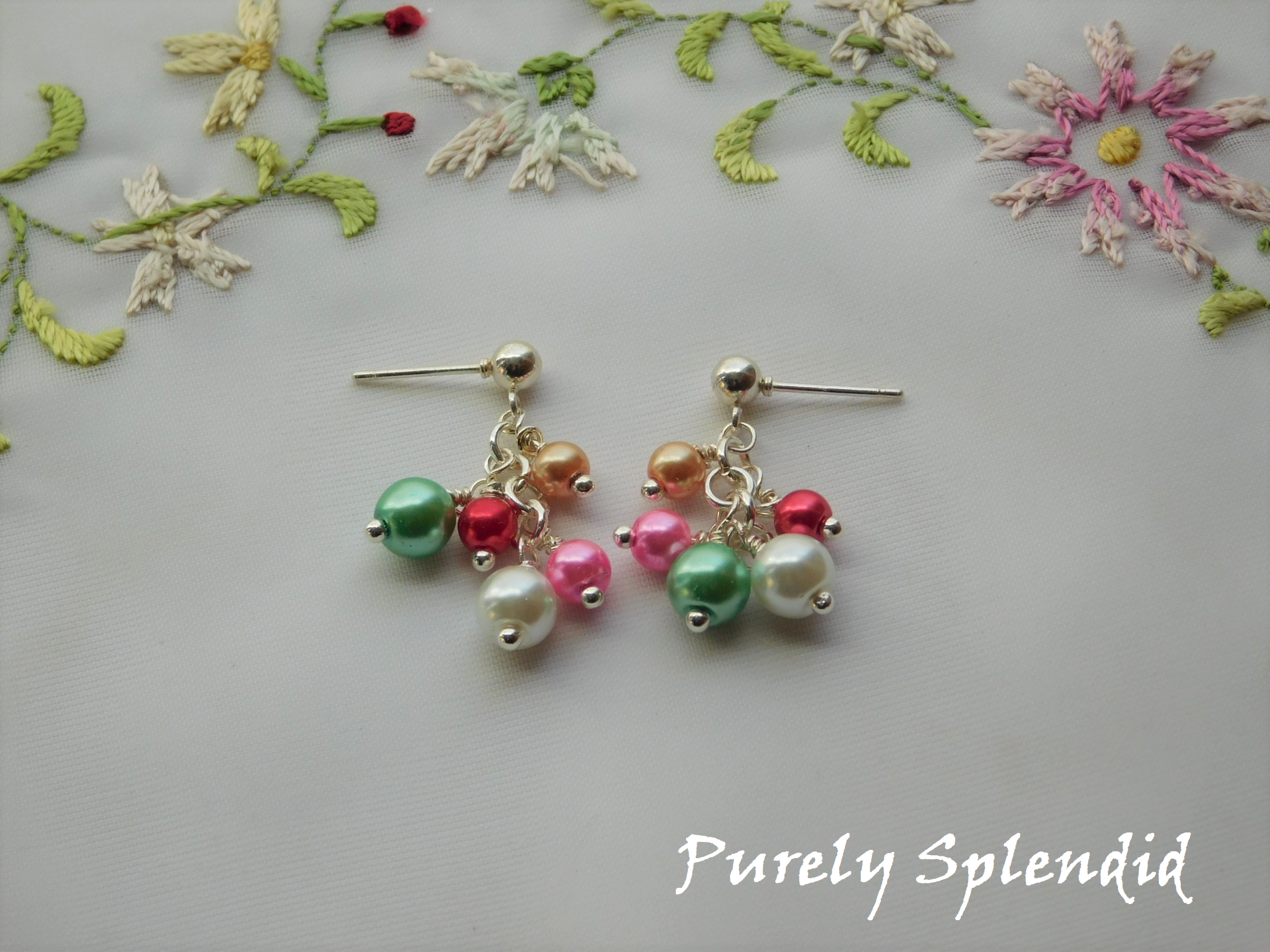 Girl Doll & Me earrings shown with five different colored pearls hanging from a silver post earring