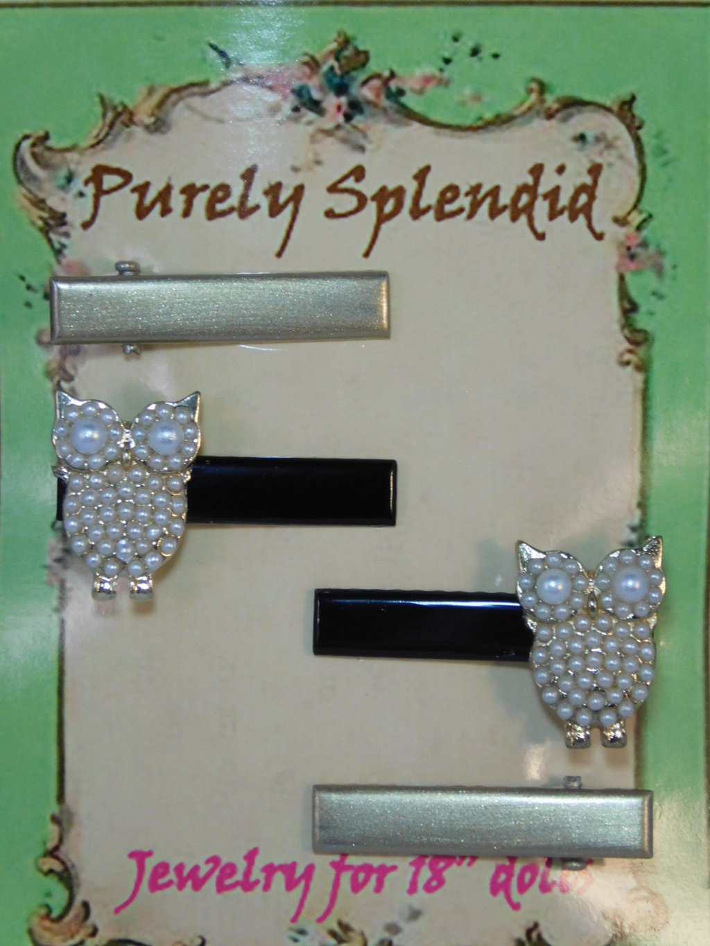 Set of four hair clips for girls or dolls - two are gold colored two are black with a pearl owl