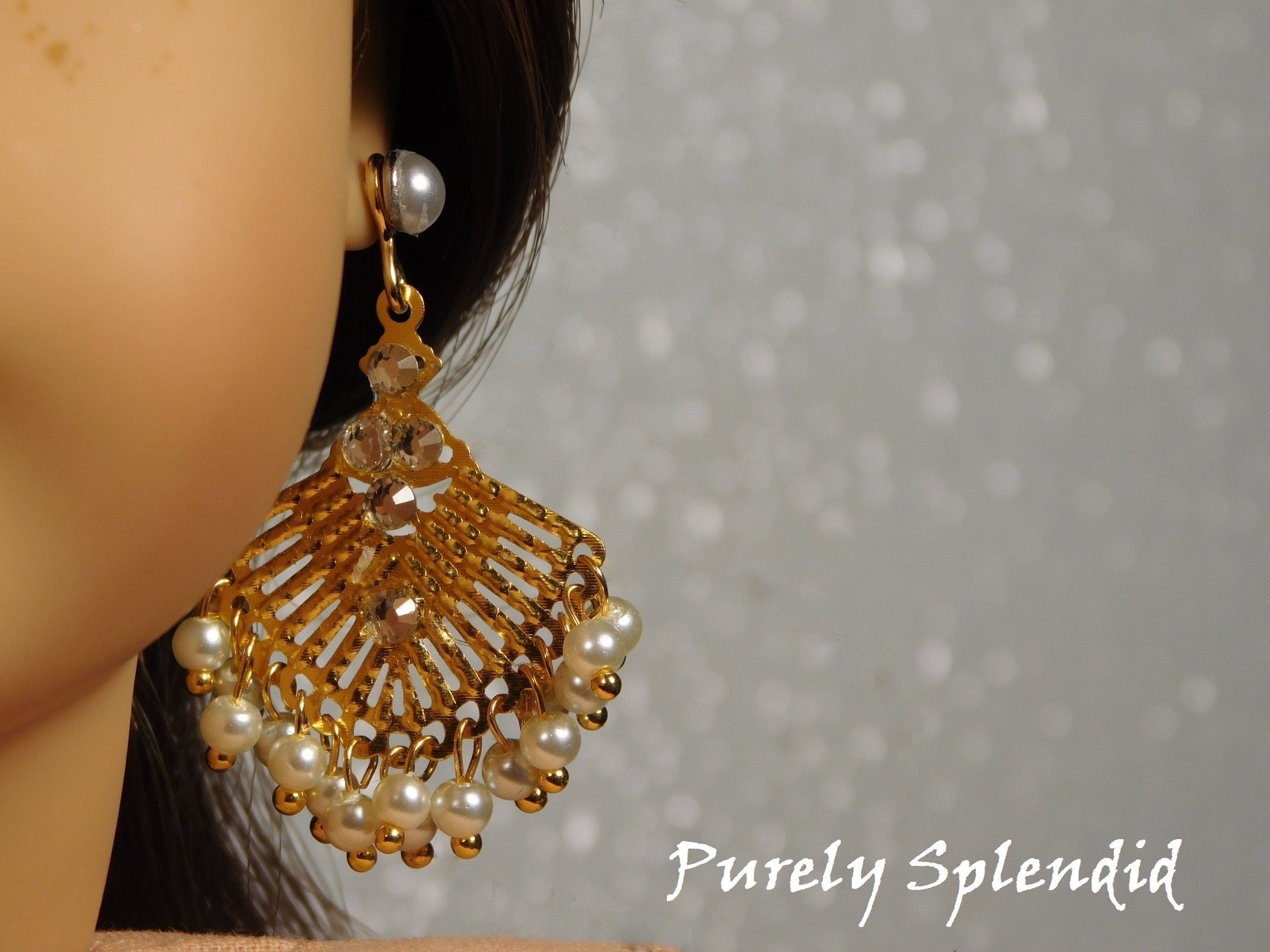 18 inch doll shown wearing a pair of white pearl studs and Pearl Bollywood Earrings