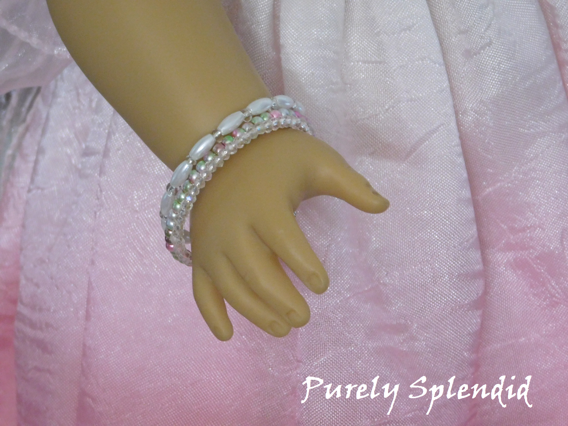 Garden Party Stacking Bracelets shown on an 18 inch doll how has a wrist of 3 1/4"