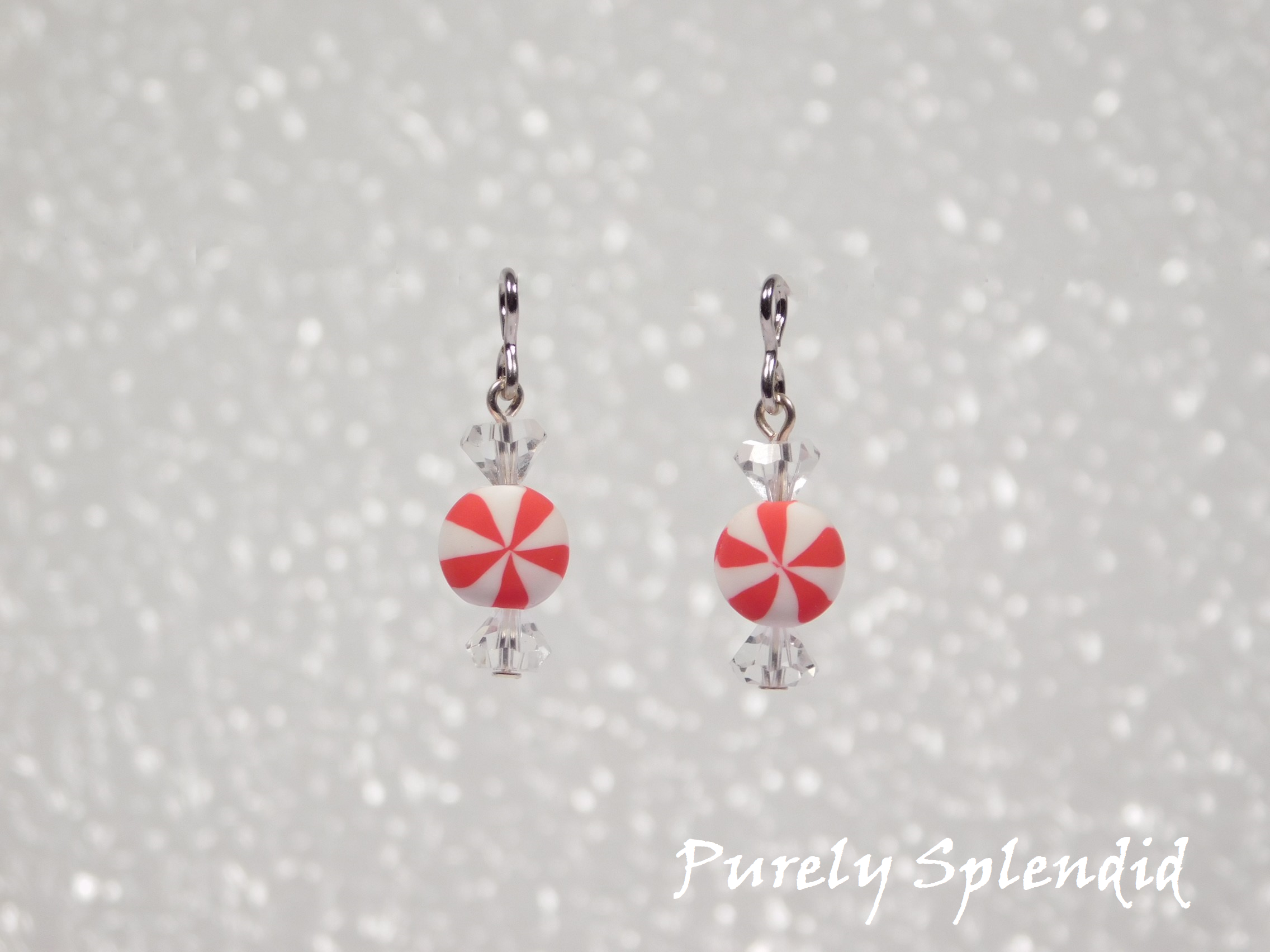 Round Red and White Peppermint Candy beads with clear crystal beads that look like a wrapped candy