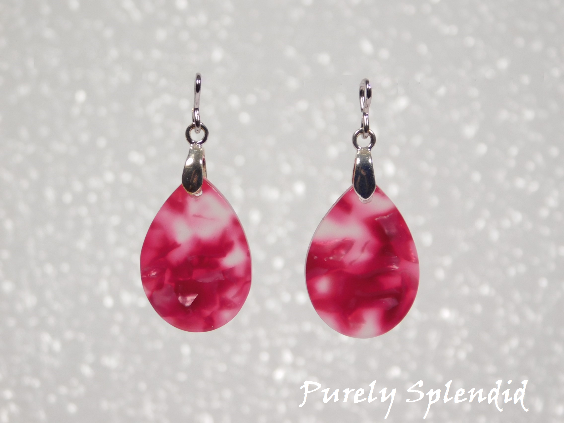 Pink Marbled teardrop shaped Earring Dangles shown on a white background