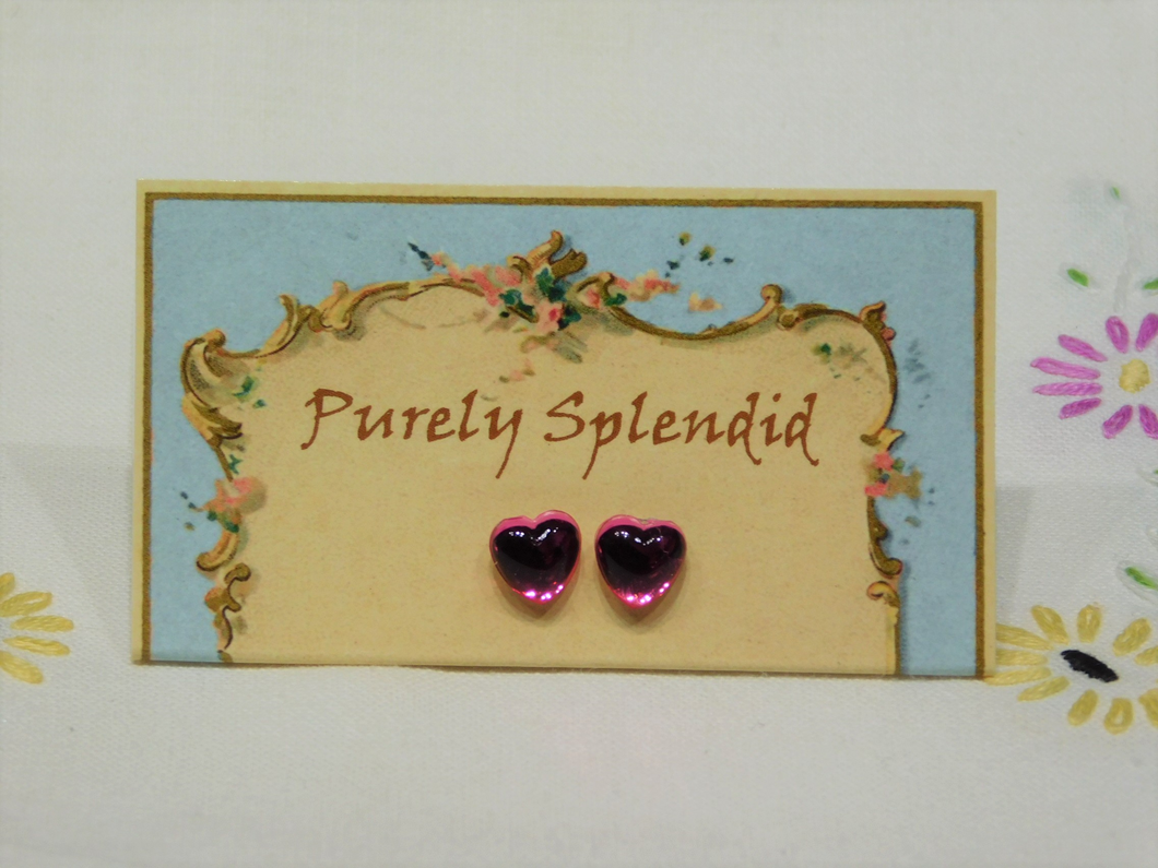 Puffy Pink Heart Studs shown on a presentation card