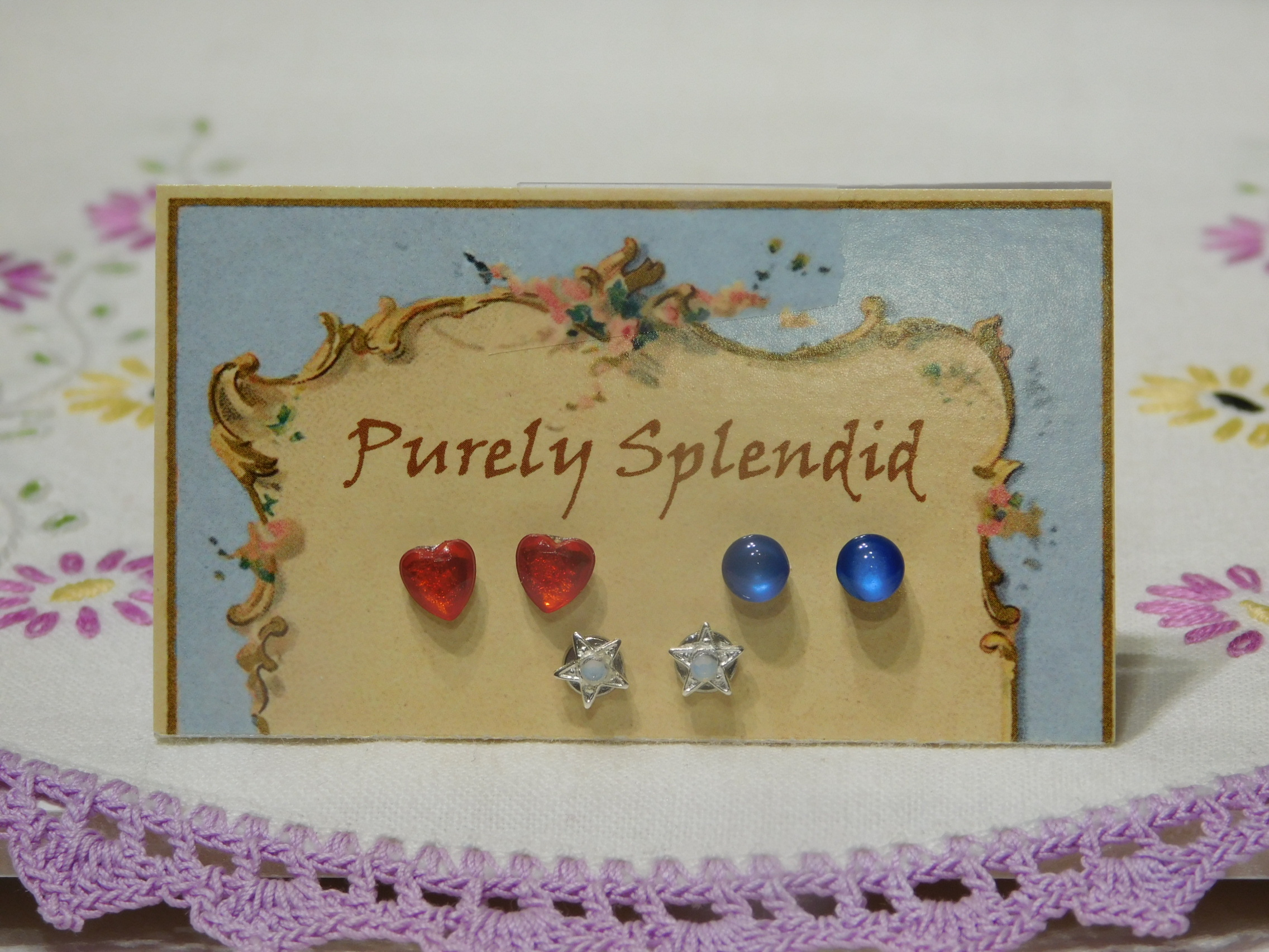 Red Hearts, Round Blue Catseye studs and a pair of Silver Star Studs for dolls