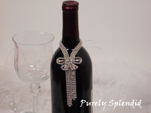 Load image into Gallery viewer, close up picture of the Sparkling Rhinestone Bow Bottle Bling on a wine bottle
