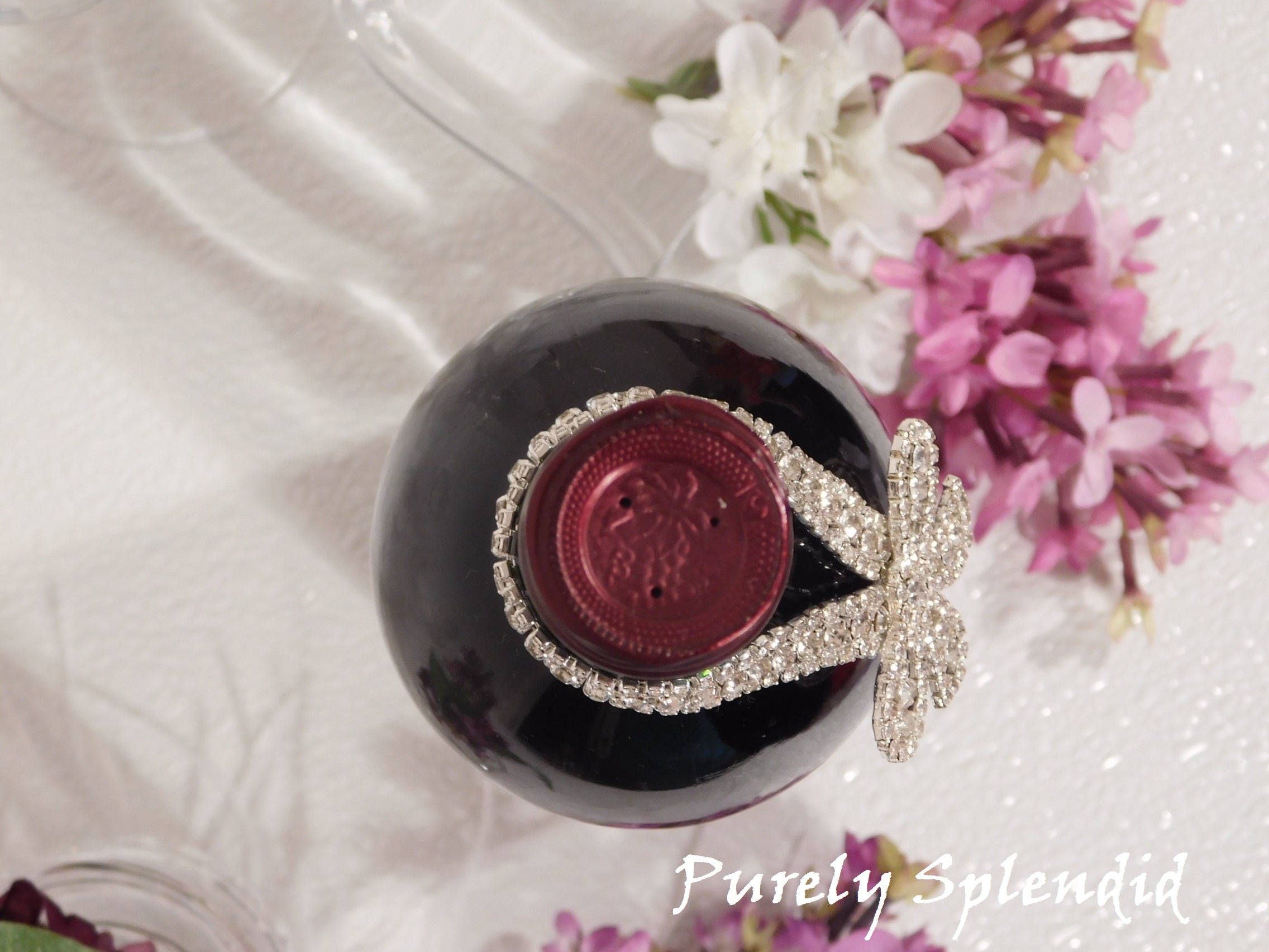 overhead view of the Sparkling Rhinestone Bow Bottle Bling on a wine bottle