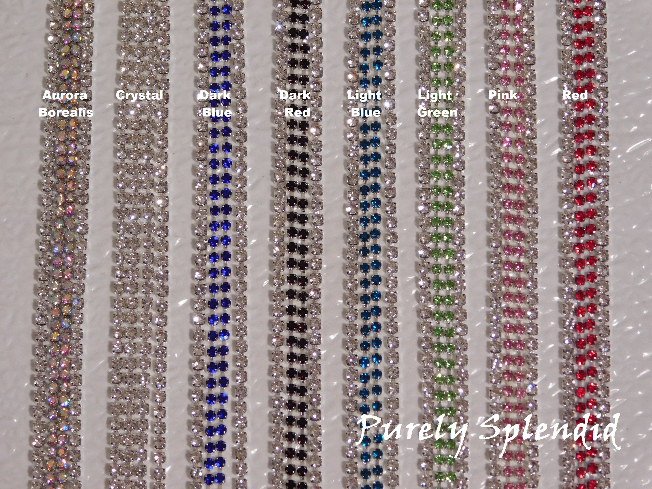 Color chart of Rhinestone options - Aurora Borealis, Crystal, Dark Blue, Dark Red, Light Blue, Light Green, Pink and Red