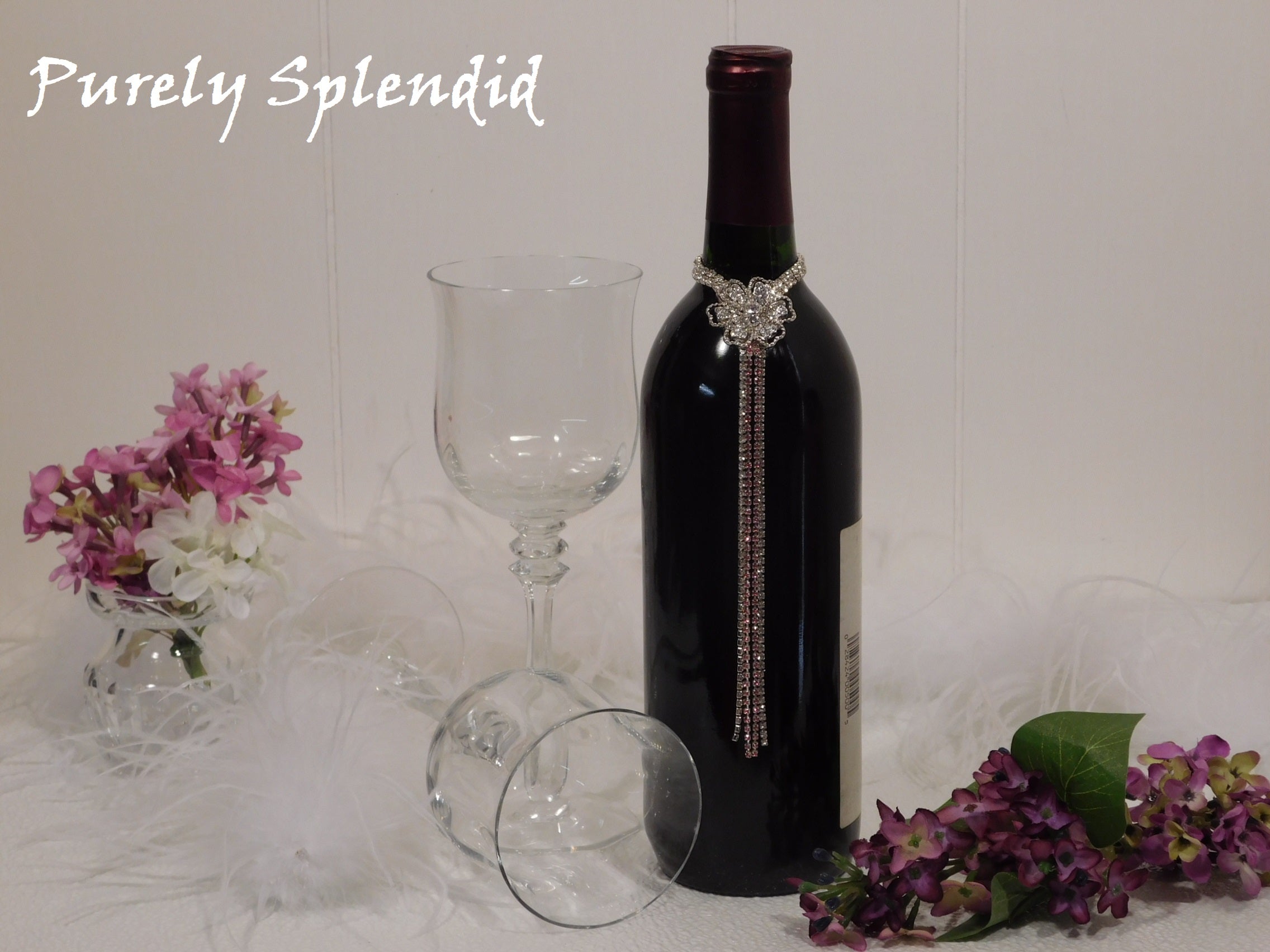 Sparkling Rhinestone Flower Bottle Bling with Pink Accents shown on a standard size wine bottle