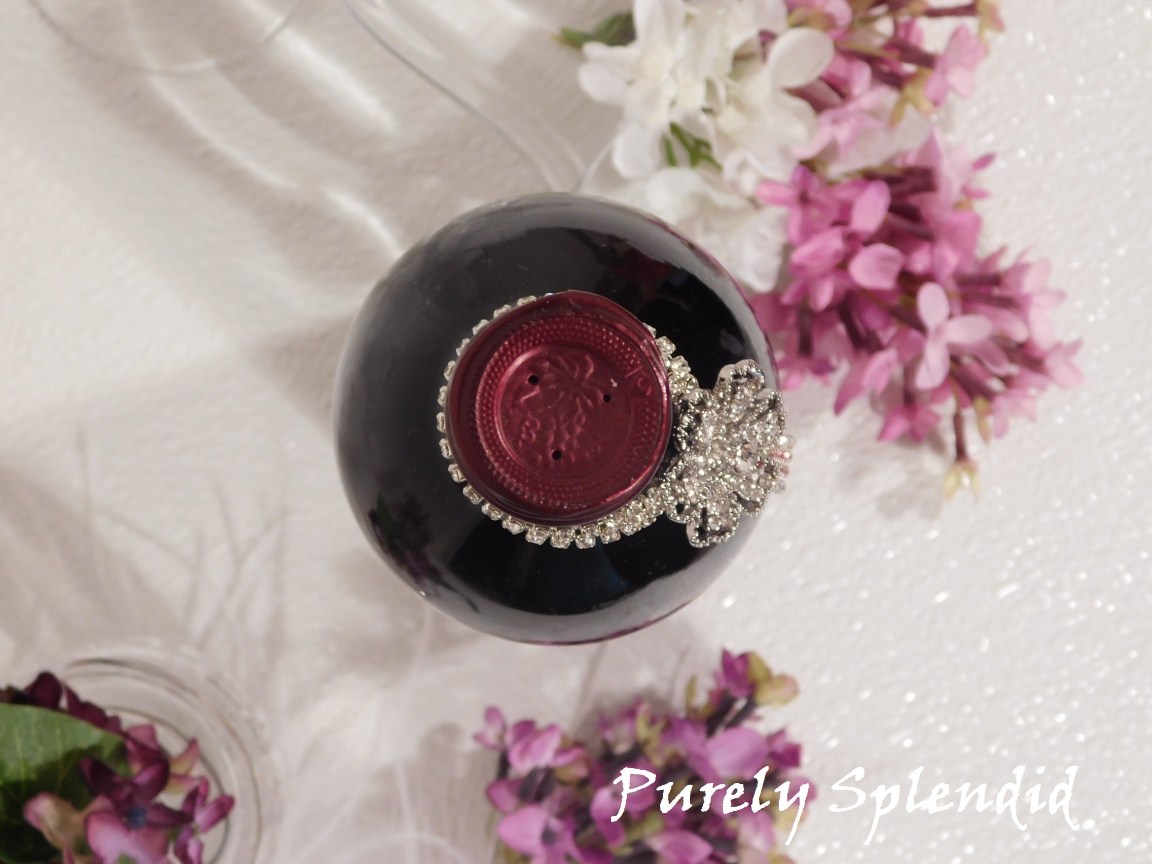 overhead view of the Sparkling Rhinestone Flower Bottle Bling on a standard size wine bottle