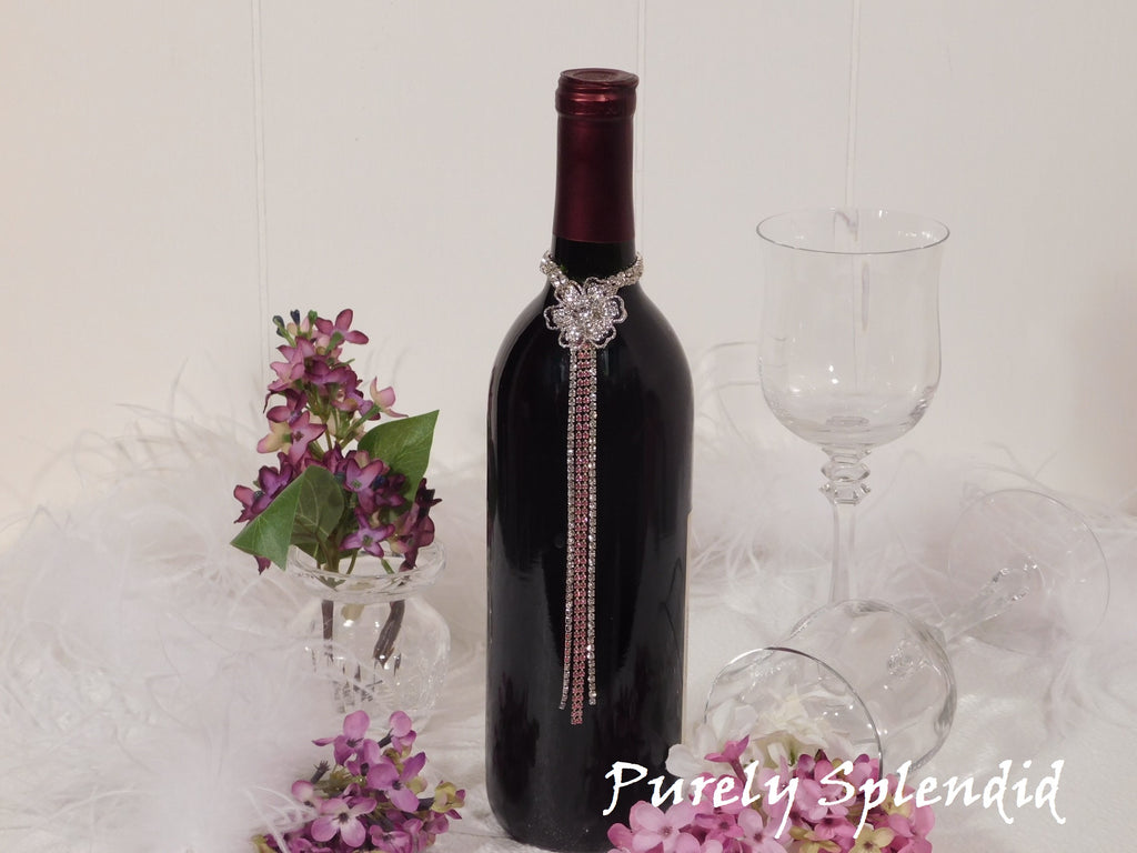 Sparkling Rhinestone Flower Bottle Bling with Pink Accents shown on the neck of a standard size wine bottle