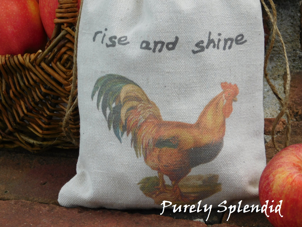 close up of a fabric bag with the image of a vintage rooster and the words rise and shine
