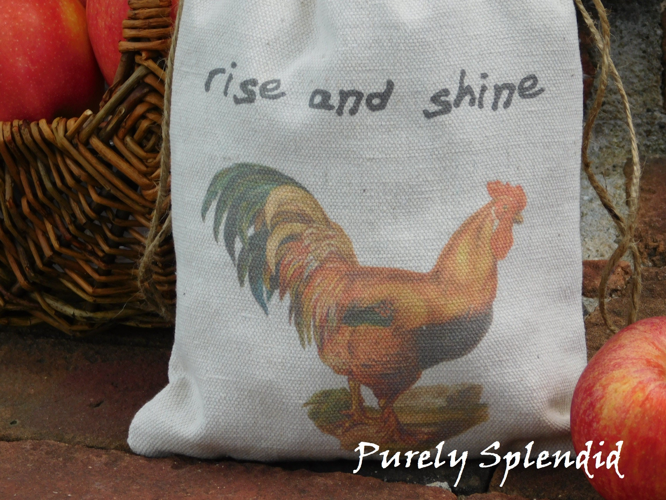 close up of a fabric bag with the image of a vintage rooster and the words rise and shine