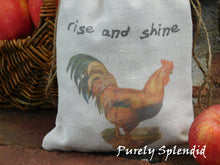 Load image into Gallery viewer, close up of a fabric bag with the image of a vintage rooster and the words rise and shine
