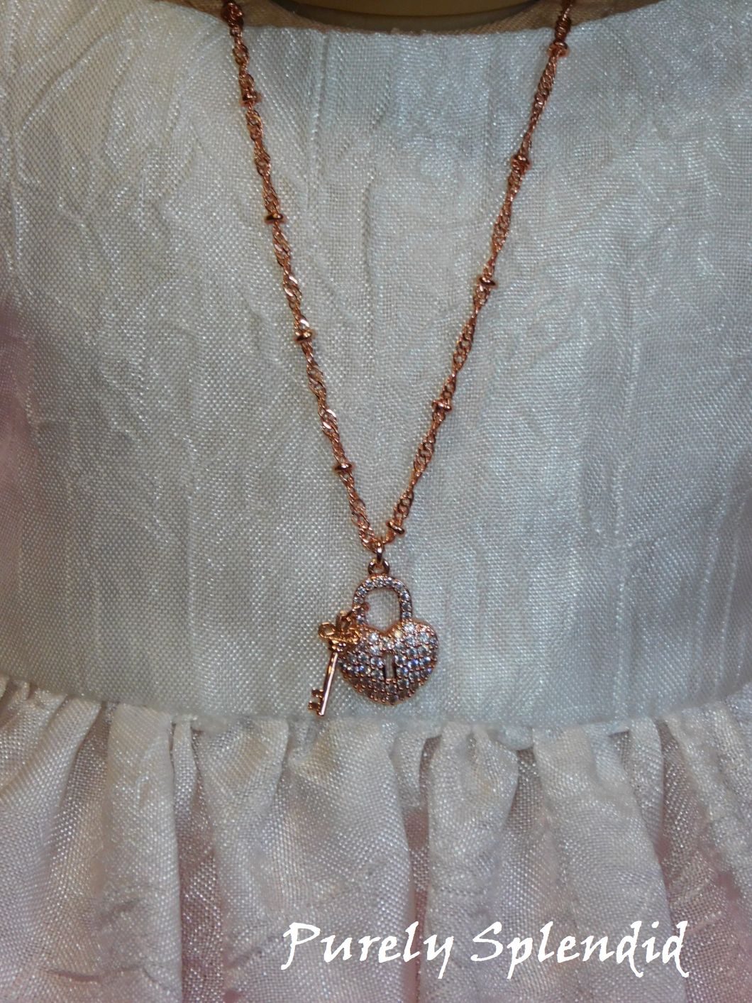 18 inch doll shown wearing this long Rose Gold Heart Lock and Key Necklace