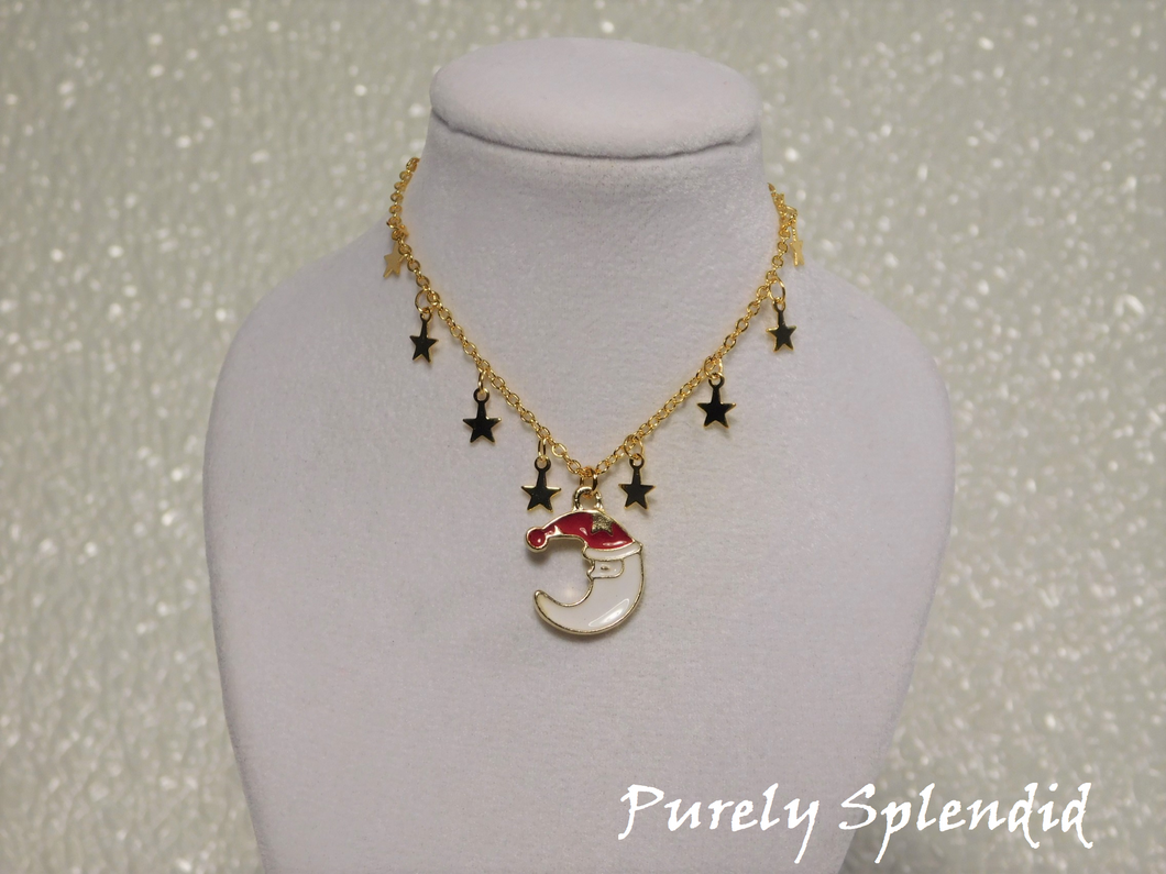 Cute Santa Moon charm on a gold chain that has mini gold star charms 