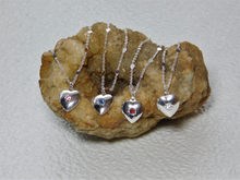 Load image into Gallery viewer, Four Silver Heart Lockets shown - each with a different center stone, pink, blue, red and crystal on a pretty silver chain
