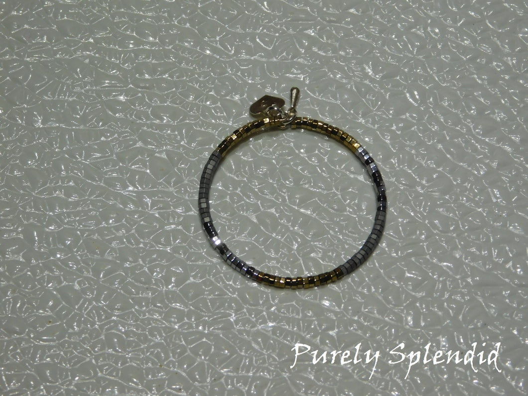 Silver and Gold micro beads make up this Silver and Gold Stacking Bracelet