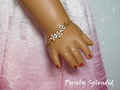 18 inch doll shown wearing a Sparkling Flower Bracelet