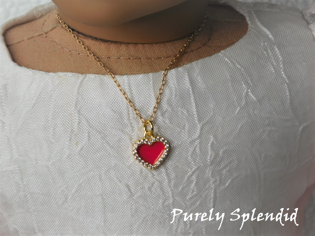 18 inch doll shown wearing a red heart necklace outlined with sparkling cubic zirconia crystals