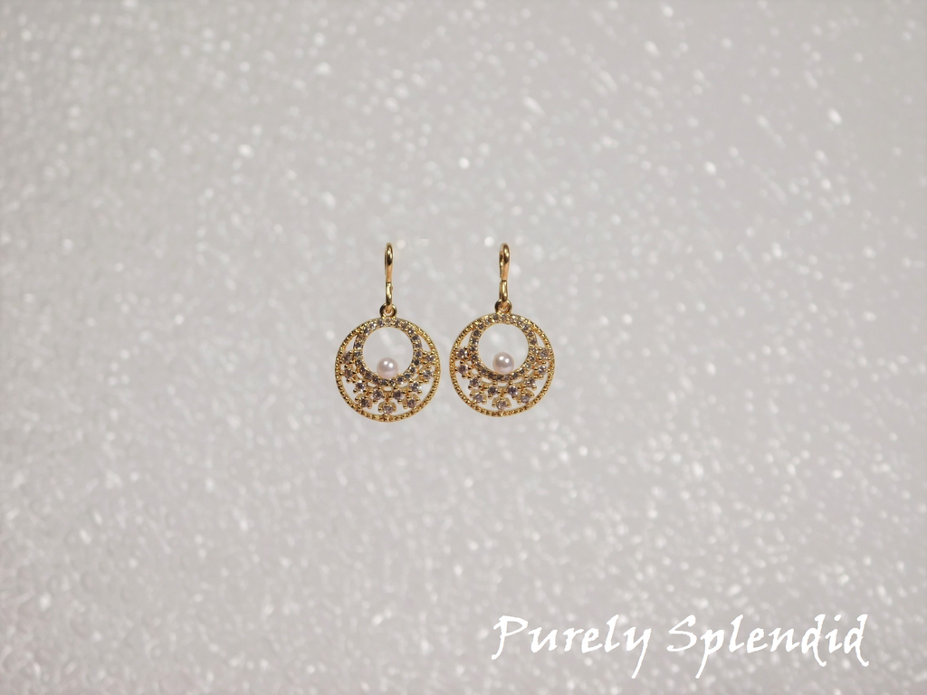 Gold colored Sparkling Indian Pearl Earrings shown on a white background