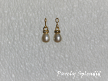 Load image into Gallery viewer, Large white pearl drop earrings with a gold sparkling ring around the top
