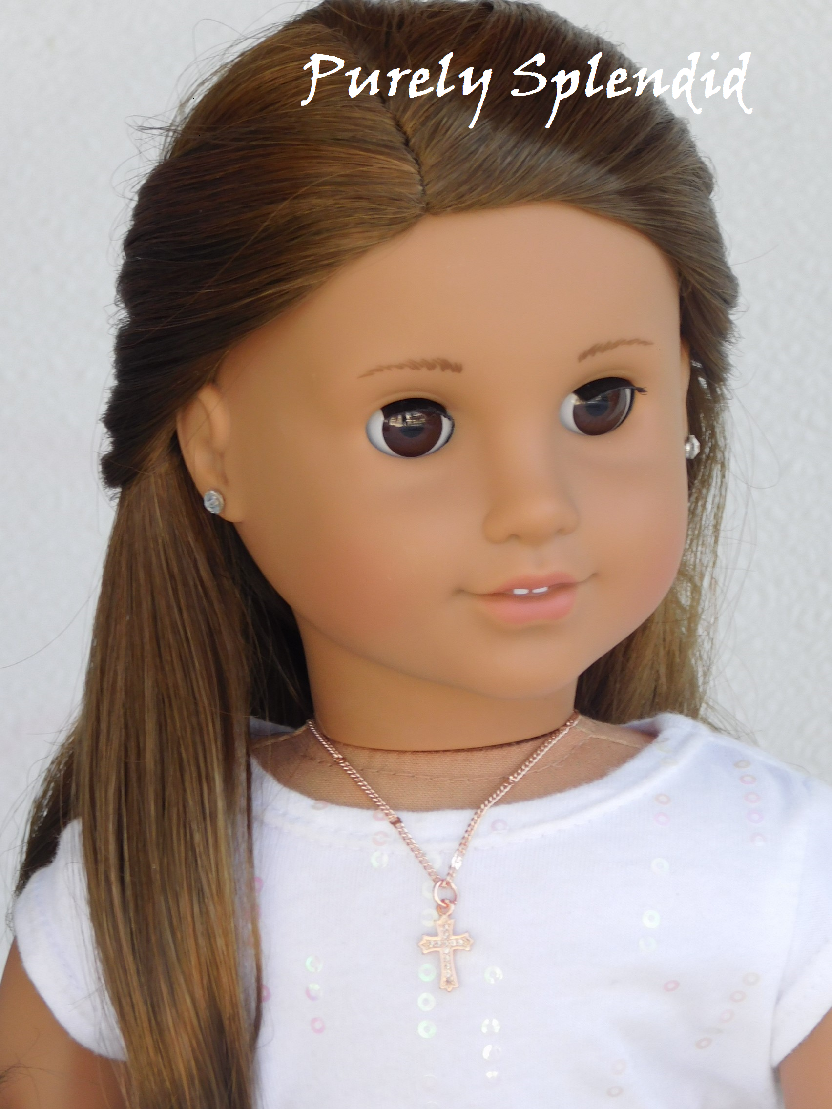 18 inch doll shown wearing the Sparkling Rose Gold Cross Necklace
