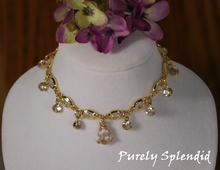 Load image into Gallery viewer, Sparkling Royalty Necklace shown on a white doll sized necklace display 
