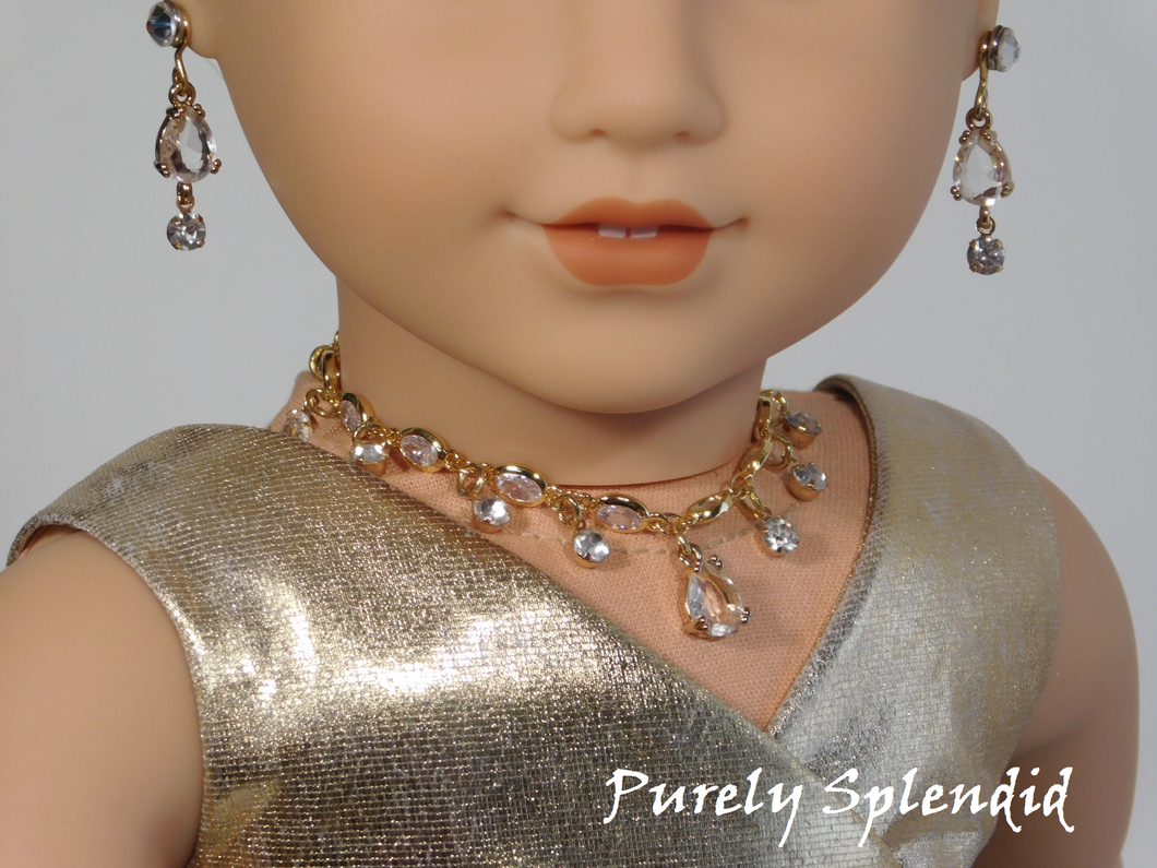 Beautiful crystal chain with one pear shape crystal hanging in the center and round sparkling rhinestones hanging around the center crystal. 18 inch doll shown wearing the necklace and earrings which feature a pair of Super Sparkling Crystal 2mm studs and Earring Dangles consist of one pear shape crystal with one round crystal rhinestone hanging from it.