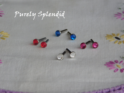 Sparkling Classic Colors Stud Earrings, Capri Blue, Crystal, Fuchsia and Light Siam on a white floral background
