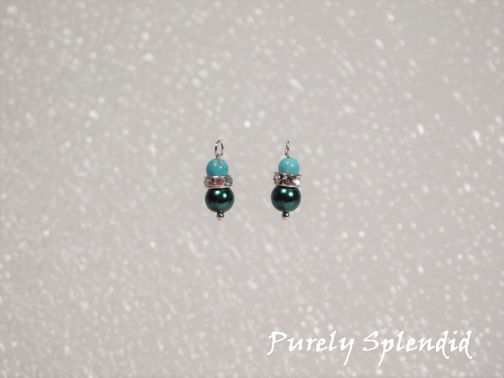 Teal glass pearl bead topped with a ring of sparkling silver and a unique round turquoise stone bead