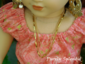18 inch doll shown wearing a Triple Gold Chain Necklace