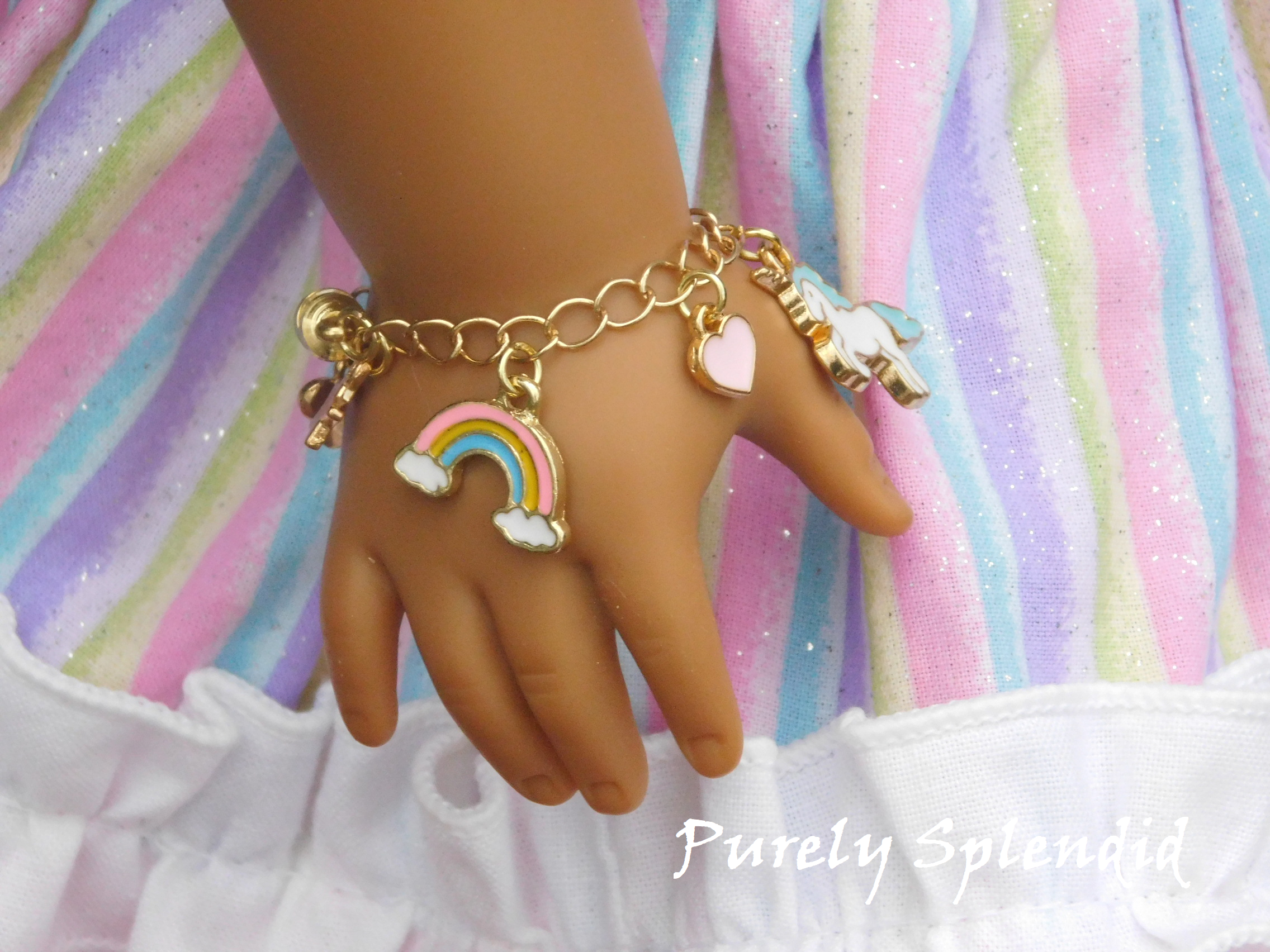 unicorn charm bracelet shown on an 18 inch doll who has a 3 1/4" wrist