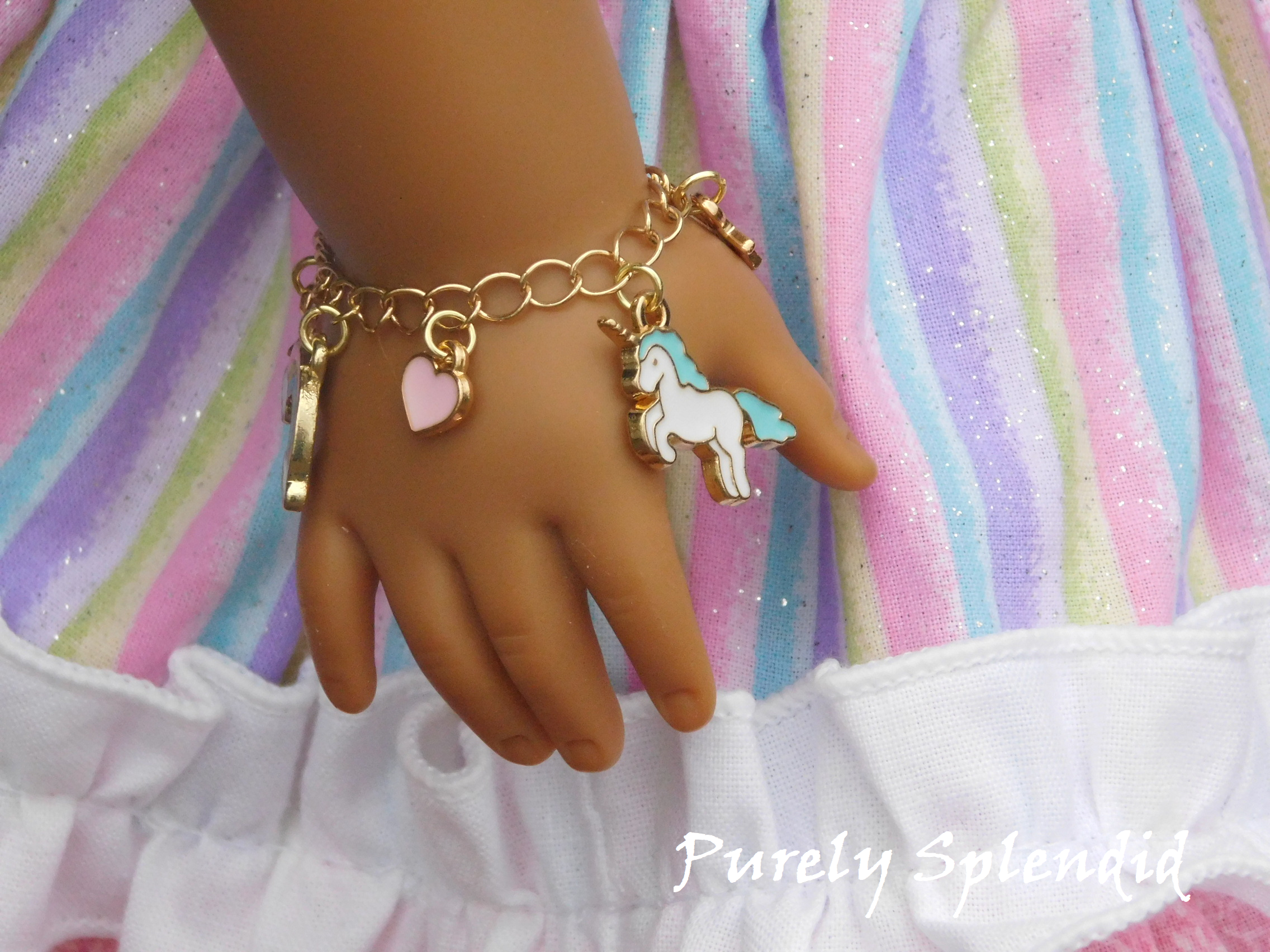unicorn charm bracelet shown on an 18 inch doll