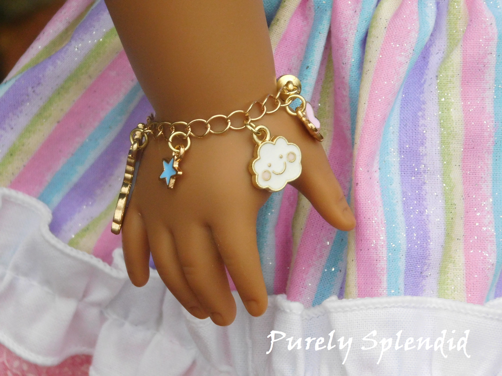 unicorn charm bracelet shown on an 18 inch doll