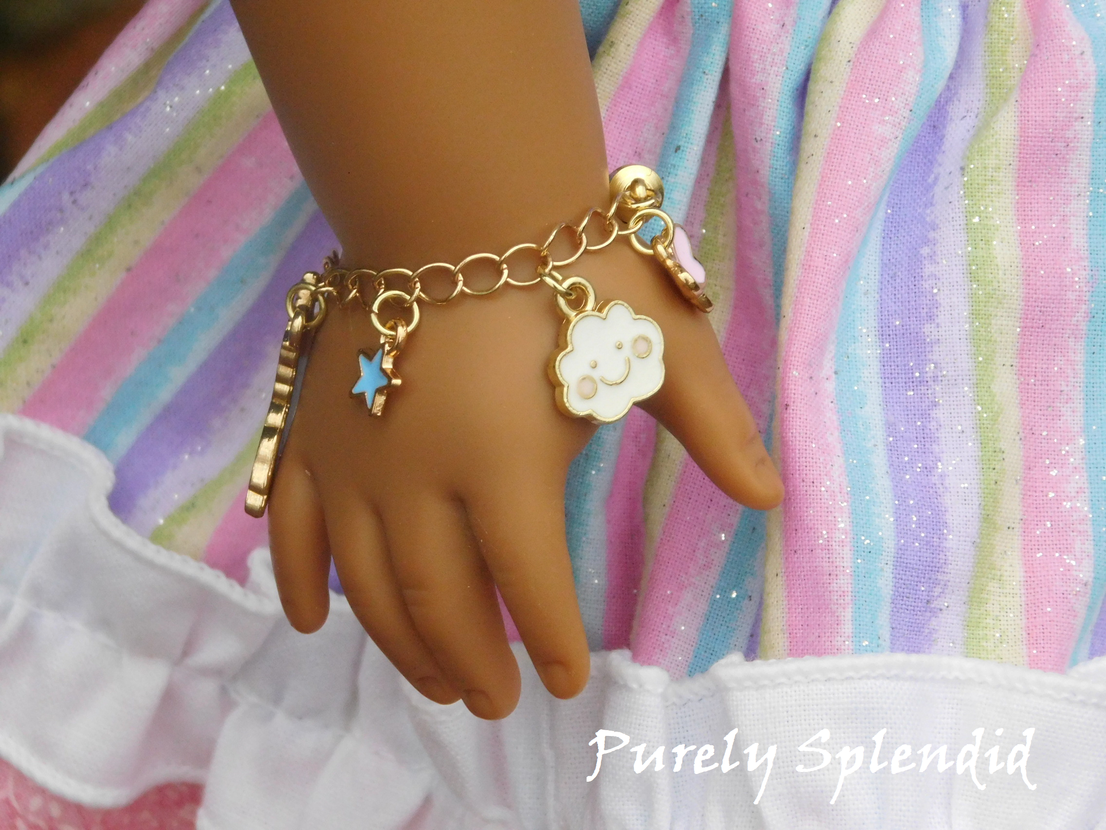 unicorn charm bracelet shown on an 18 inch doll