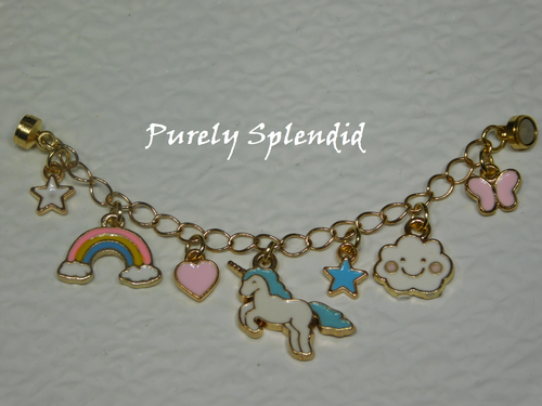 seven mini charms- white star, rainbow, pink heart, white and blue unicorn, blue star, white happy cloud and pink butterfly