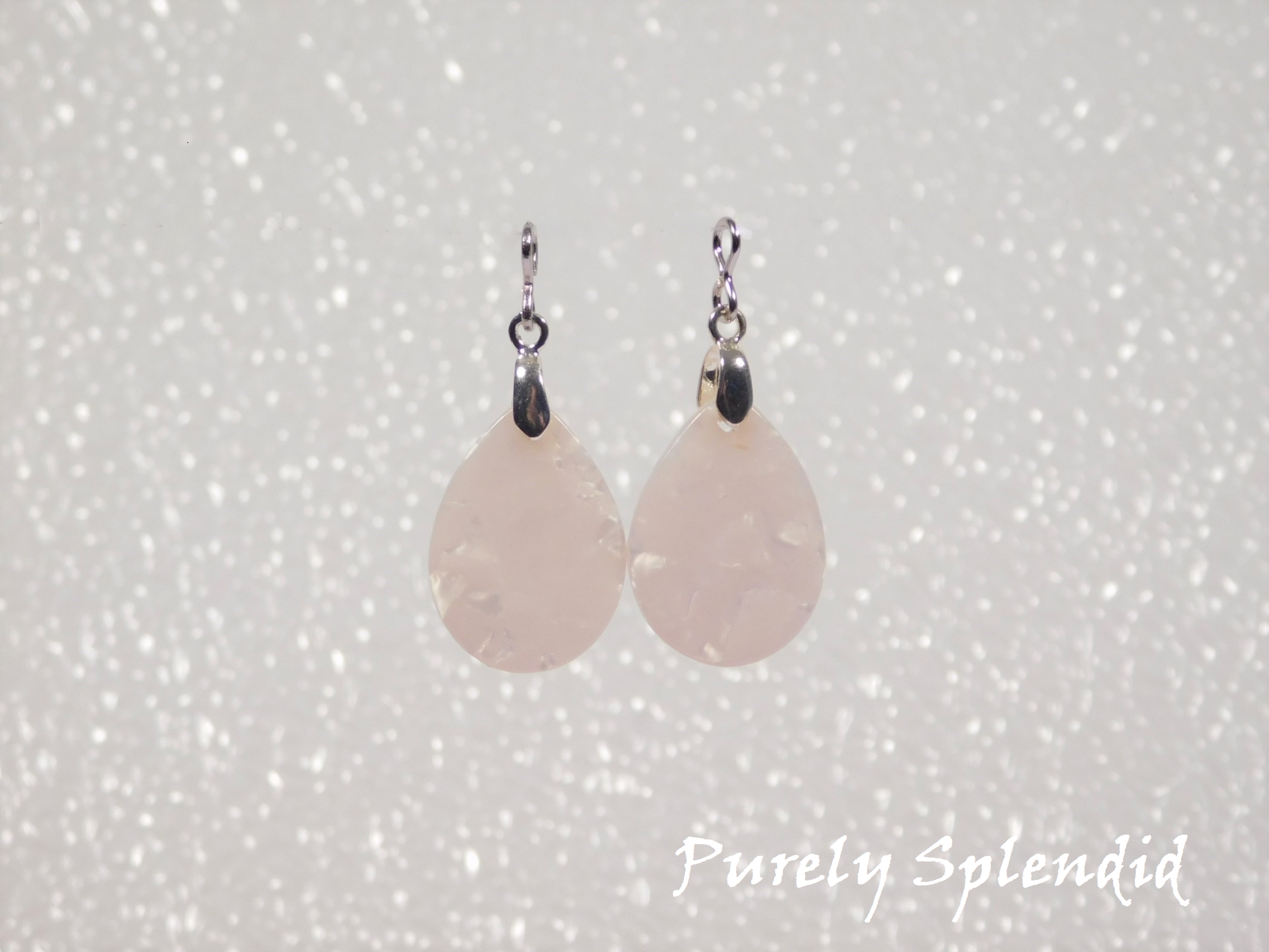 White Marbled teardrop shaped Earring Dangles shown on a white background