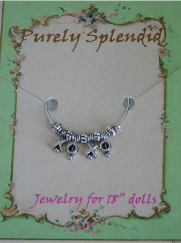 Name Bracelet which reads XOXO on a Purely Splendid display card 